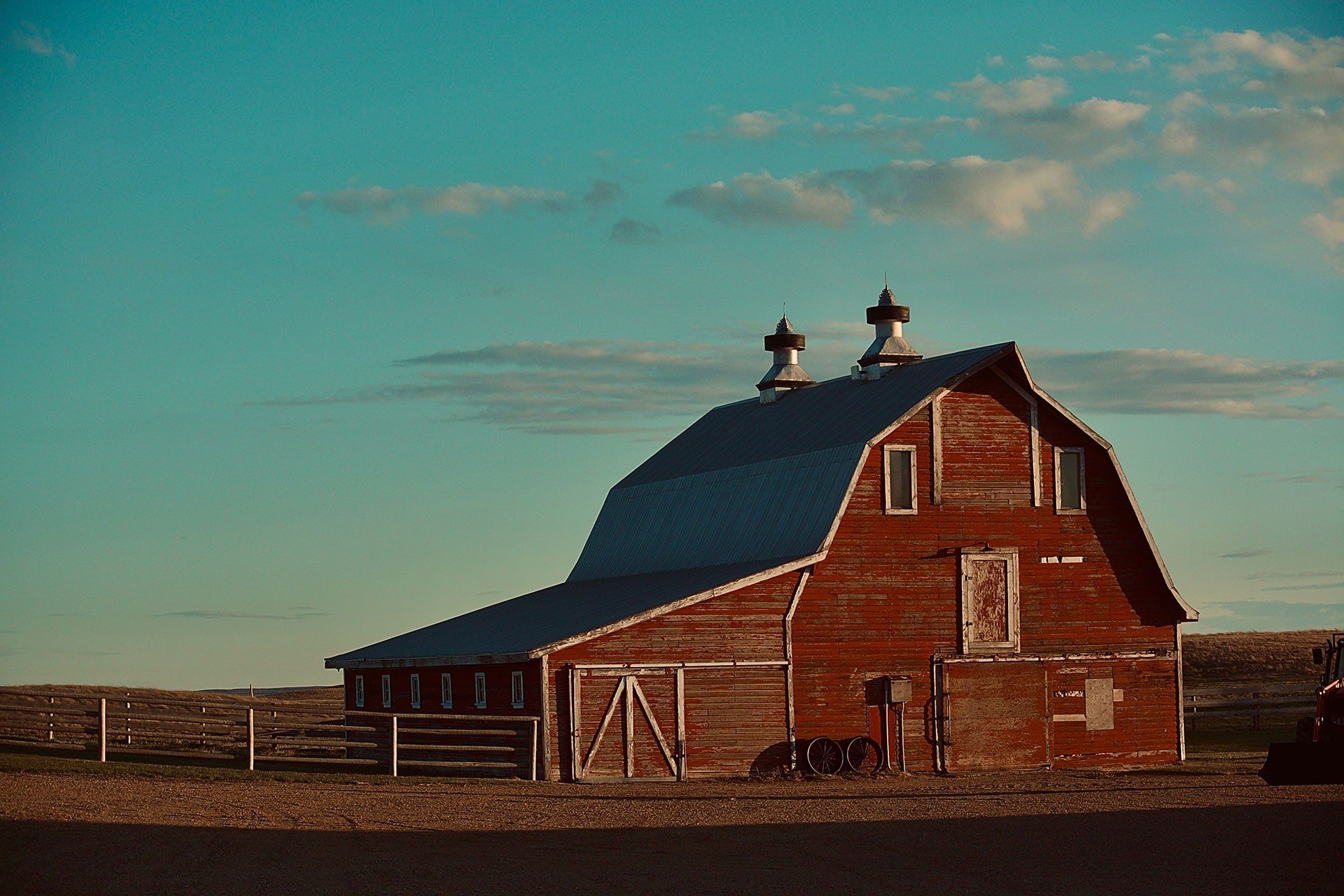 Classic red barn at sunset