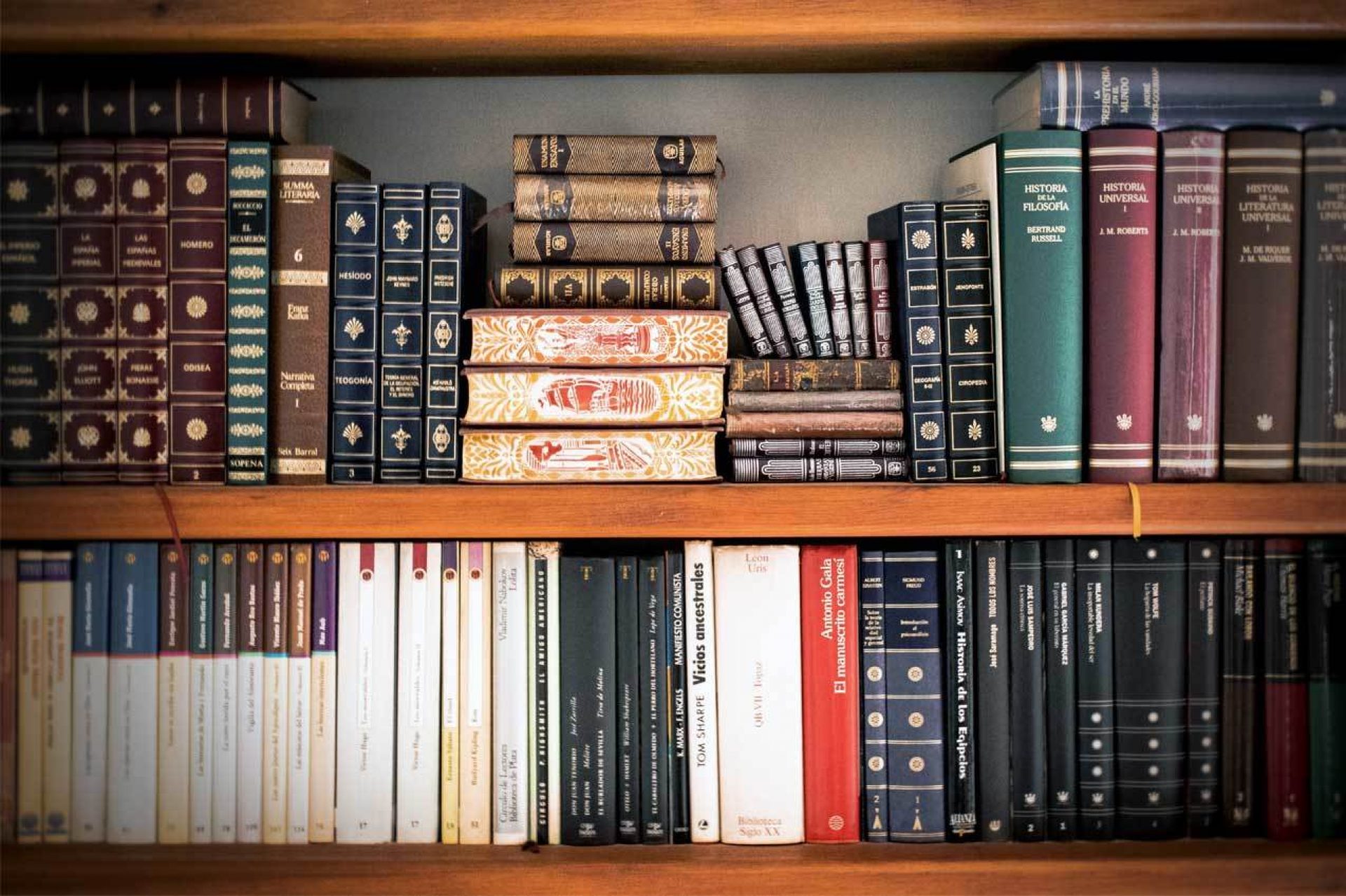 Stack of books on shelf in library