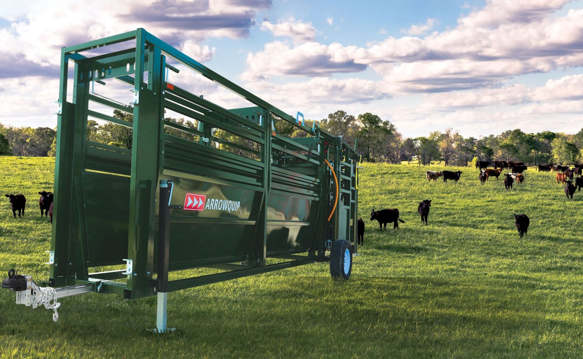 Portable cattle tub and alley sitting in a field prepared for towing