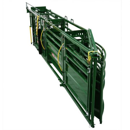Portable squeeze chute folded for towing