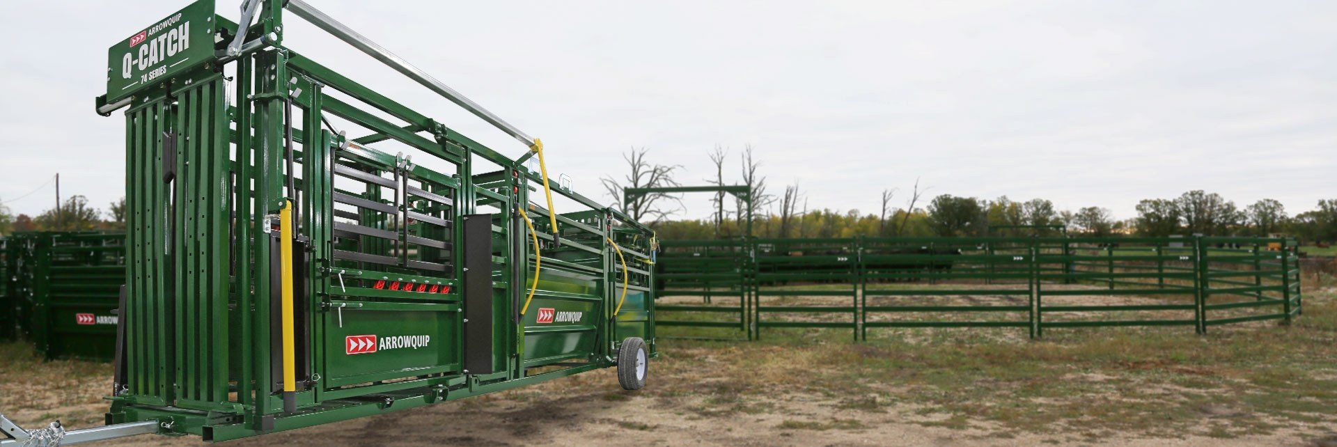 Q-Catch 74 Series portable squeeze chute alley and tub in a field